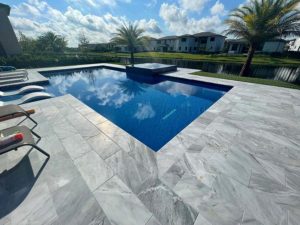 StoneHardscapes Bianca neve tumbled marble pavers and coping pavers 12x24
