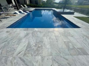 StoneHardscapes Bianca neve tumbled marble pool deck pavers 12x24