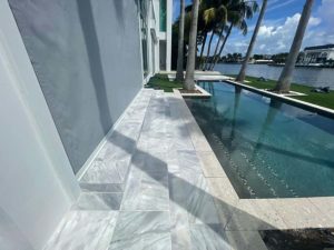 StoneHardscapes Bianca neve tumbled marble pool deck stairs pavers 12x24