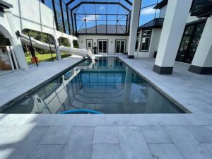 StoneHardscapes ice xtreme grip marble pavers coping and pool deck 16x24