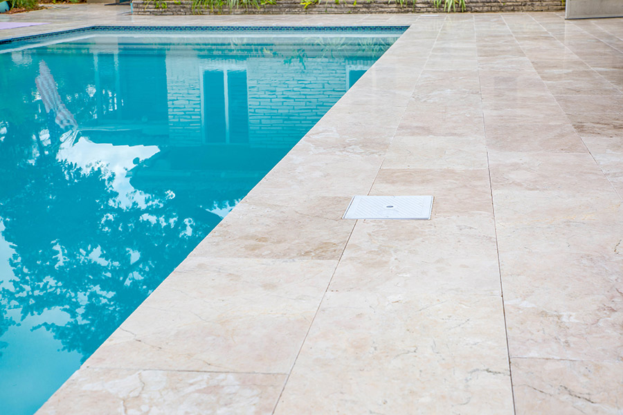 StoneHardscapes Corsica Marble Pavers Pool Deck and Coping
