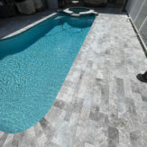 StoneHardscapes marina grey tumbled marble pavers french pattern 12X24 pool deck
