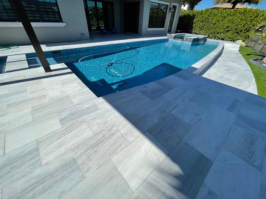 StoneHardscapes aspen white marble pavers pool deck and coping 16x24