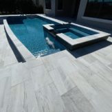 StoneHardscapes aspen white marble pavers pool deck , coping and spa 16x24