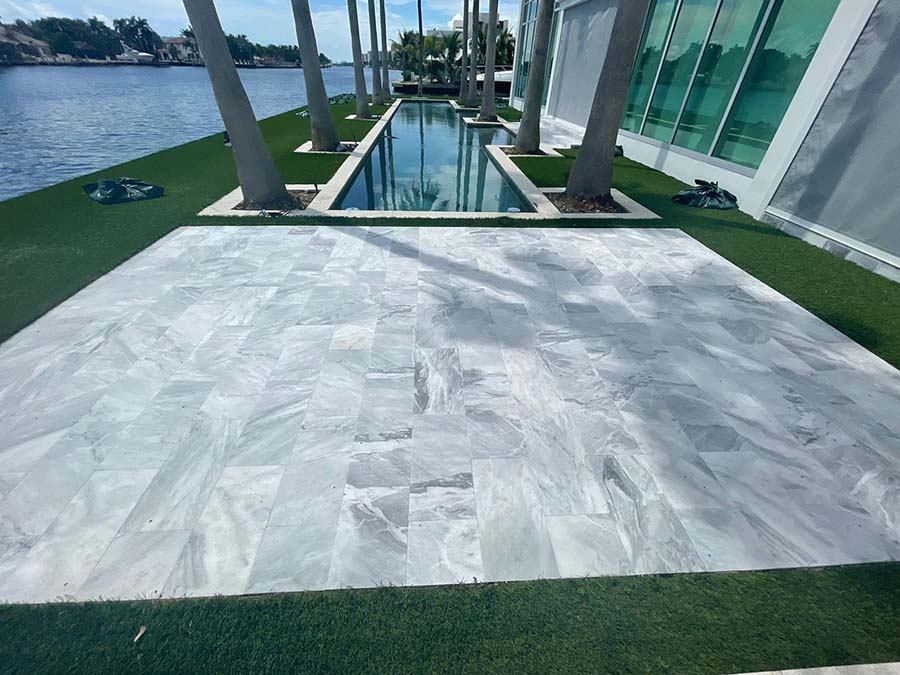 StoneHardscapes Bianca neve tumbled marble pavers deck 12x24