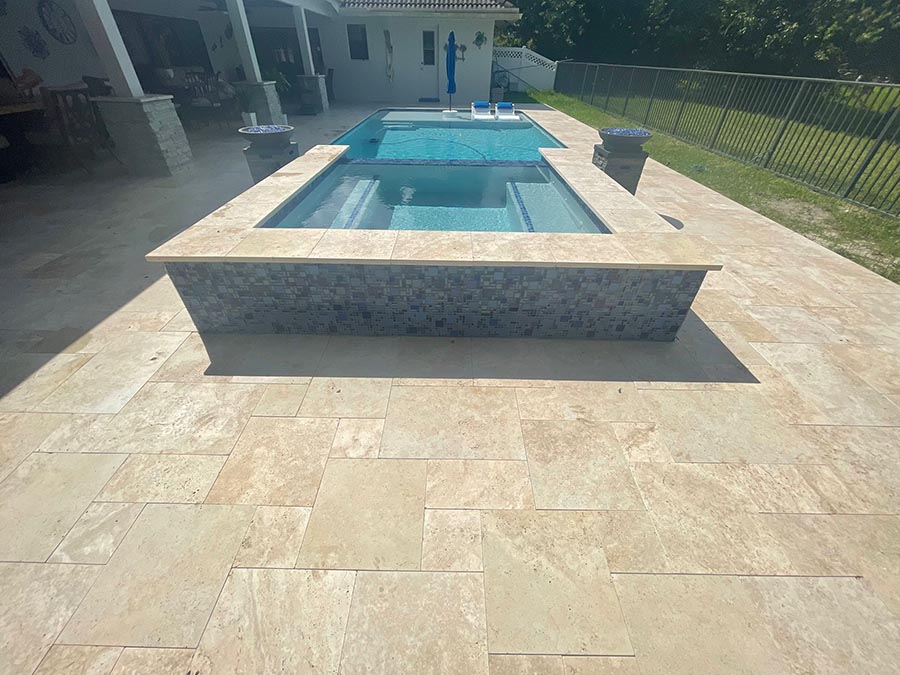 StoneHardscapes ivory premium travertine french pattern pavers pool and deck