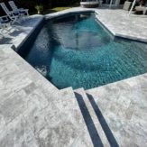 StoneHardscapes french pattern marina grey leathered marble pavers pool deck 6x12