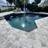 StoneHardscapes french pattern marina grey leathered marble pavers pool deck and coping 6x12