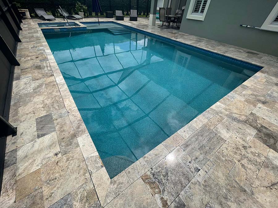 StoneHardscapes silver premium travertine pool deck and spa french pattern pavers 6x12