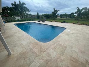 StoneHardscapes ivory plus travertine pavers pool and deck french pattern
