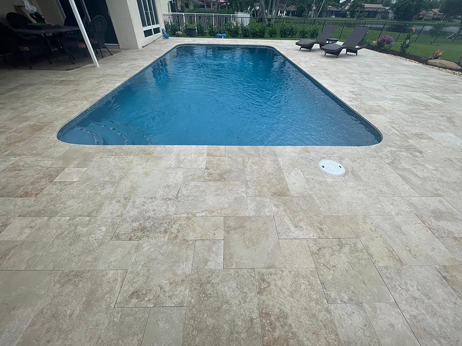 StoneHardscapes ivory plus travertine pavers pool and deck sealed french pattern