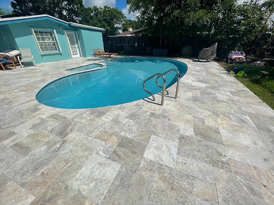 StoneHardscapes Keffalinia marble pool deck in french pattern