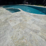 StoneHardscapes Keffalinia marble pool deck in french pattern
