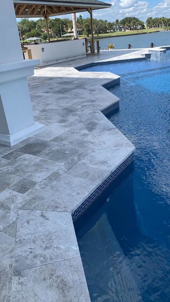 StoneHardscapes marina grey leathered marble pavers pool coping french pattern