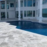 StoneHardscapes marina grey leathered marble pavers pool and deck french pattern