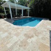 StoneHardscapes mocha premium travertine pavers pool deck french pattern